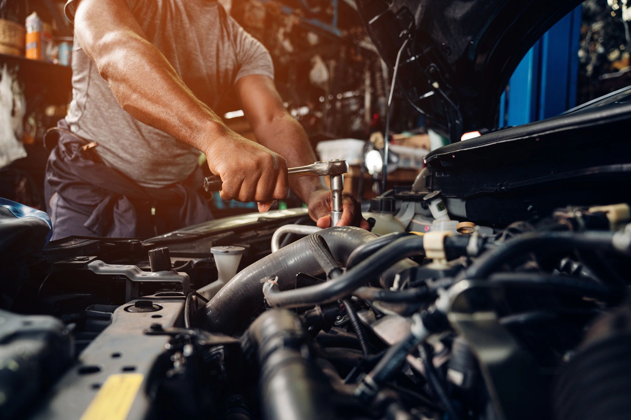 Mechanic working on a car engine