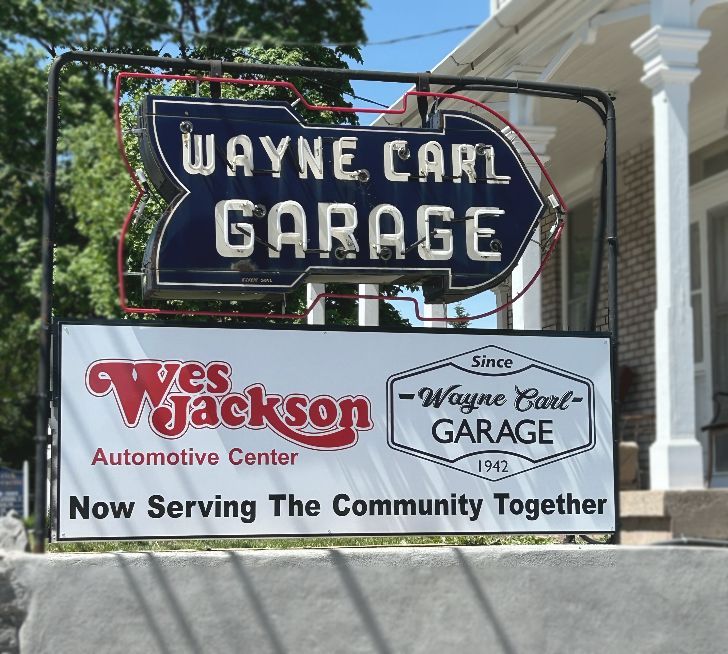 Sign outside the garages of Wayne Carl Garage and Wes Jackson Automotive.